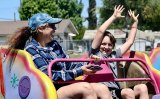Families take a turn on the Sizzler ride Saturday at the first Lemoore Days, held at the Lemoore Sports Complex this past weekend.